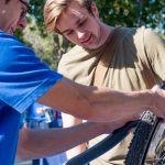 Bike Program Intern Fixing Flat Tire.