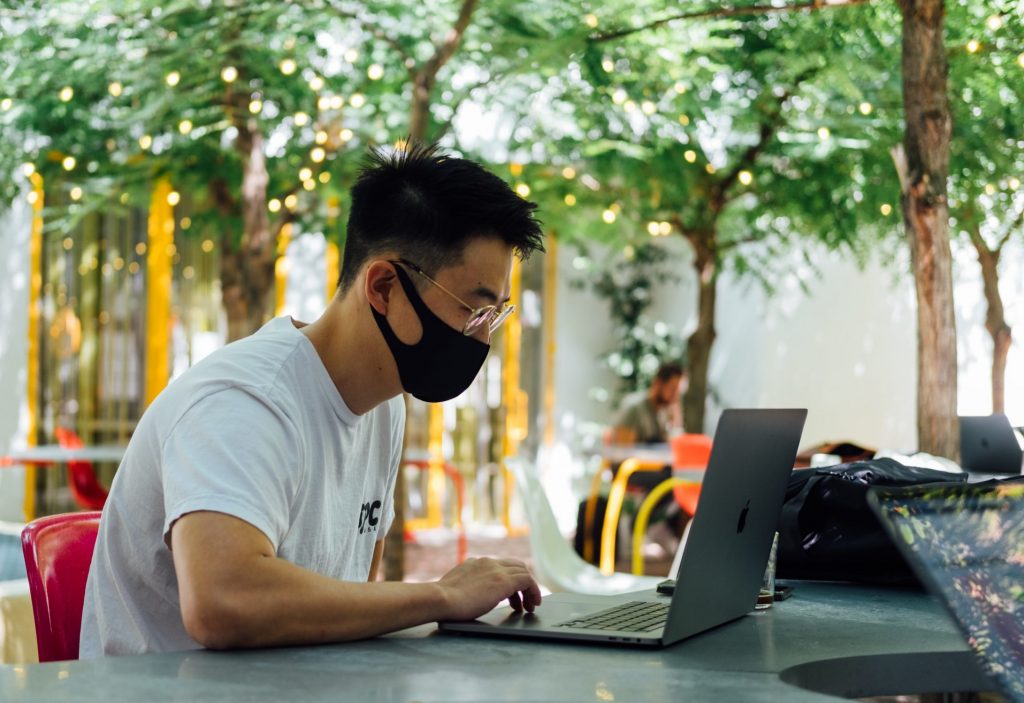 Student using computer for research. 