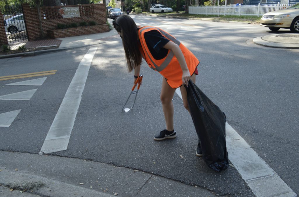 UF student picking up litter