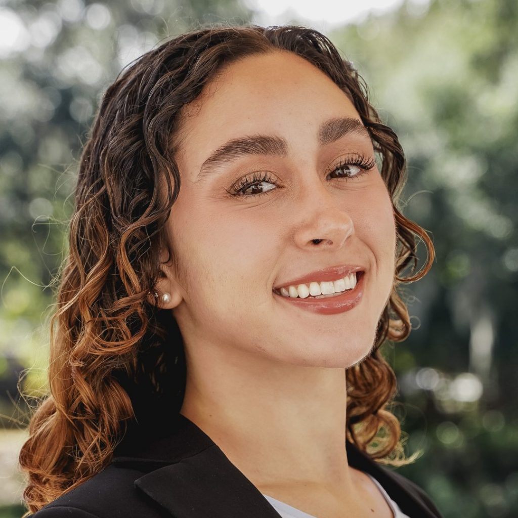 Valentina Padron-Rasines, UF student and Green Gator of the Month, headshot outdoors.