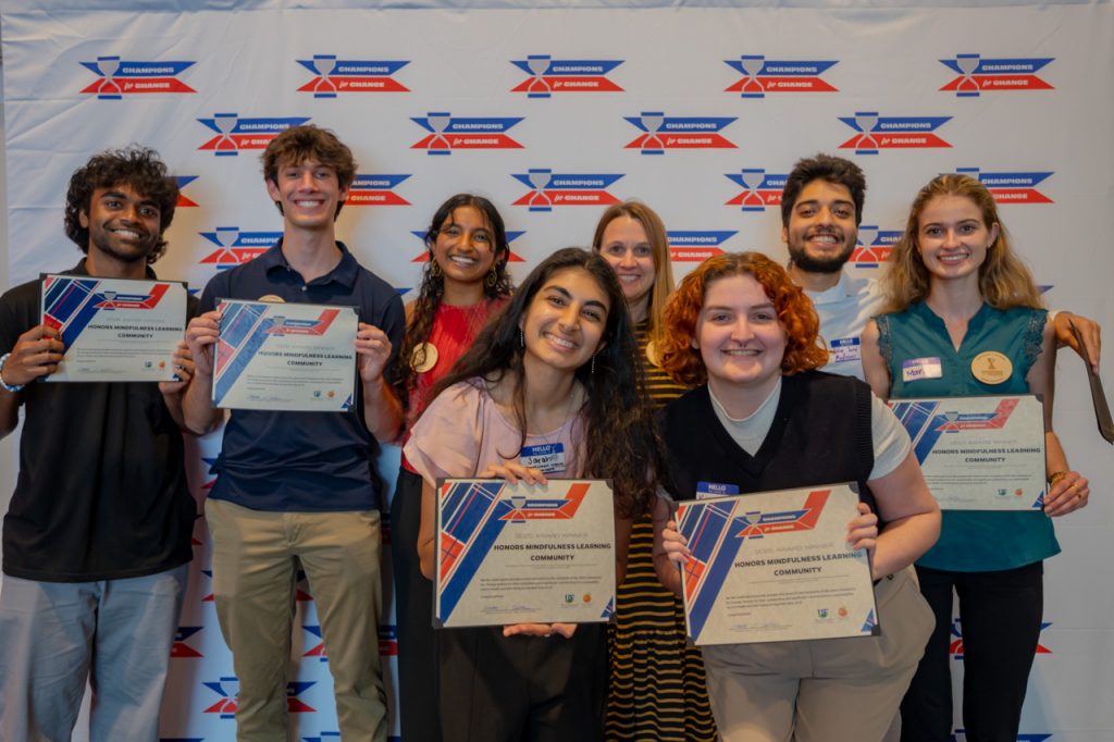 2025 Champions for Change Award Recipients, Honors Mindfulness Learning Community, pose with their award certificate.