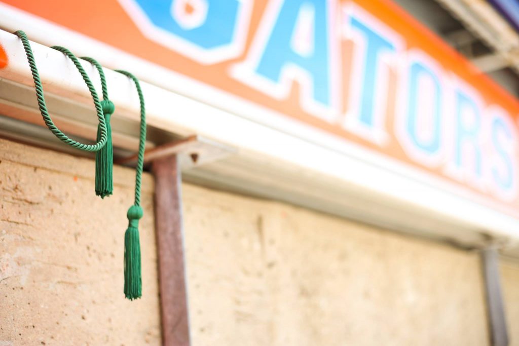 Gator green cord balanced on stadium seat