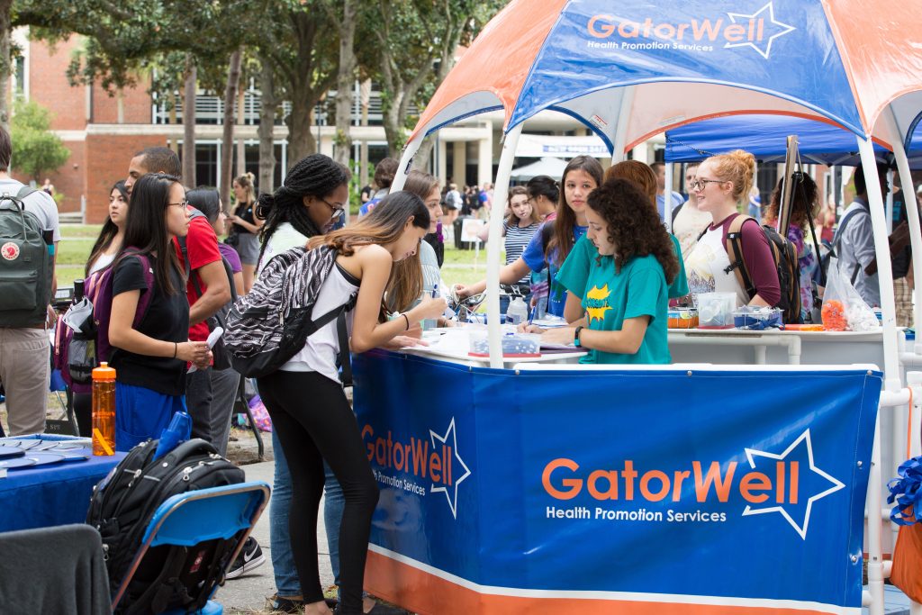 Students crowd the GatorWell Hut at Plaza of the Americas