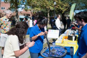 Student Organization helps inflate tires at Sustainable Transportation Fair