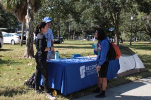 Students stop at the RecSports table during the Sustainable Transportation Fair