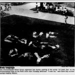 An elevated photo of students collectively creating the words "UF Earth Day" by lying down in the shape of letters on Reitz Lawn