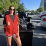 UF student recycling and performing waste management