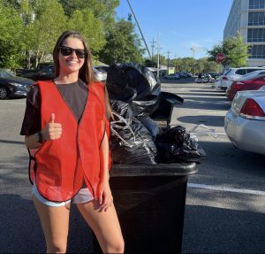 UF student recycling and performing waste management