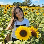 UF student Gali Polichuk with sunflowers.