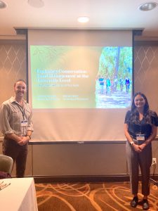 UF Staff Kaylee August with her fellow presenter collaborating during a conference session at AASHE 2023.